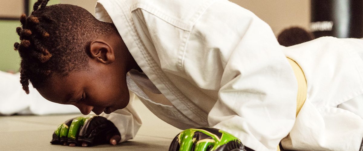 A focused young Premier Martial Arts student training
